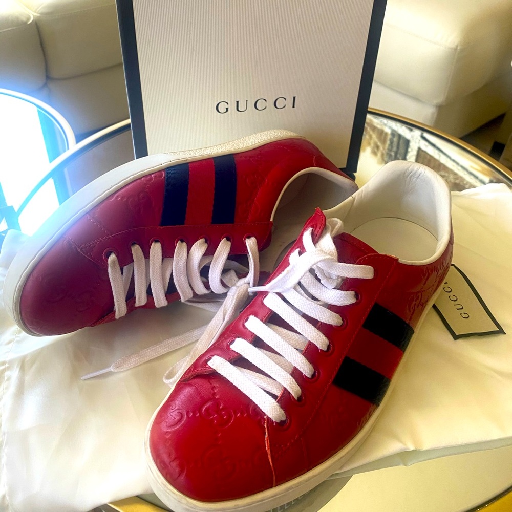 Gucci red monogrammed sneakers